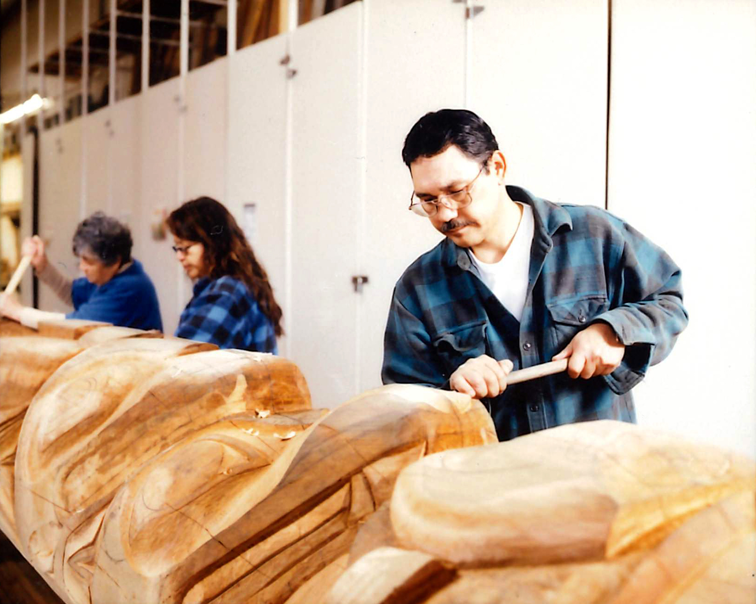 Carving the Education is Unity Pole