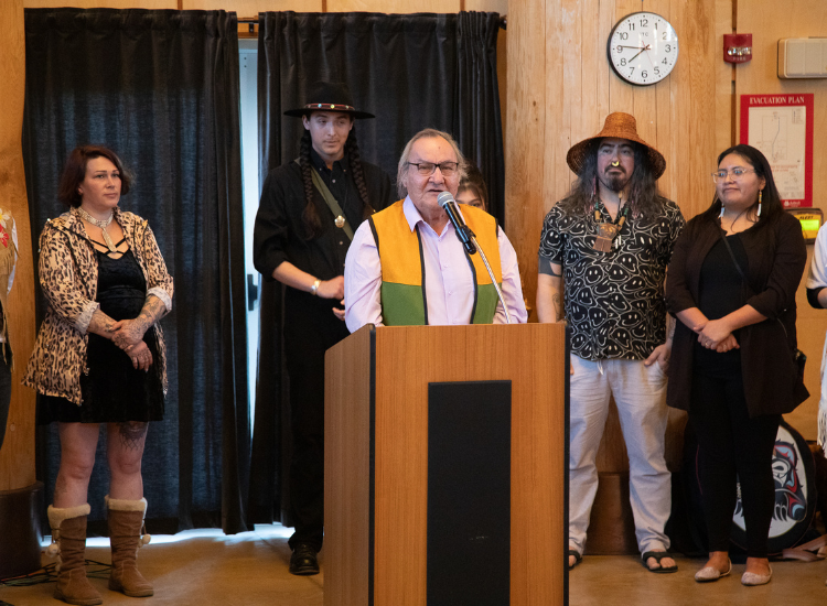 Dene'Tum speaks at the student art exhibit.