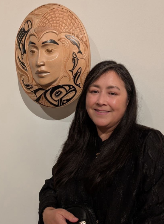 Arlene Ness with her carved mask.