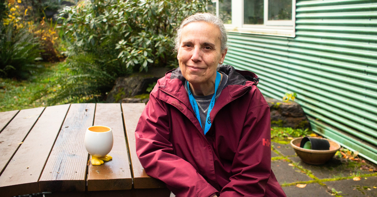 Emilia McConville sits at a table at the Prince Rupert Campus